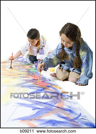 Girl and her brother painting on the floor View Large Photo Image Stock Image - Girl and her brother painting on the floor. Fotosearch