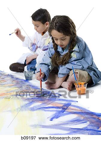 Girl and her brother painting on the floor View Large Photo Image Stock Photo - Girl and her brother painting on the floor. Fotosearch