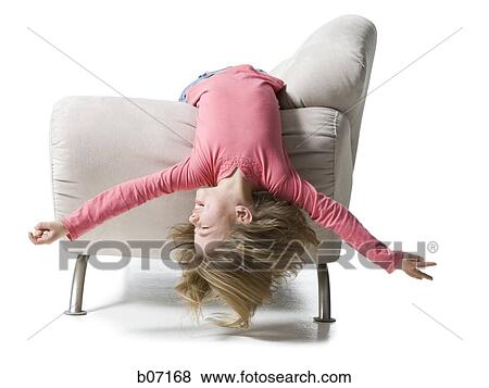 Girl bending backwards over couch View Large Photo Image Stock Photo - Girl bending backwards over couch. Fotosearch