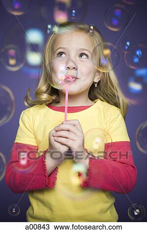 Girl blowing bubbles View Large Photo Image Stock Image - Girl blowing bubbles. Fotosearch