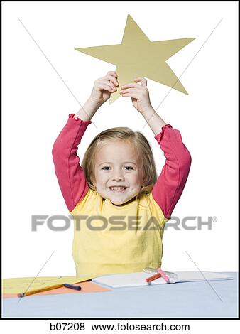 Girl holding up star View Large Photo Image Stock Photo - Girl holding up star. Fotosearch