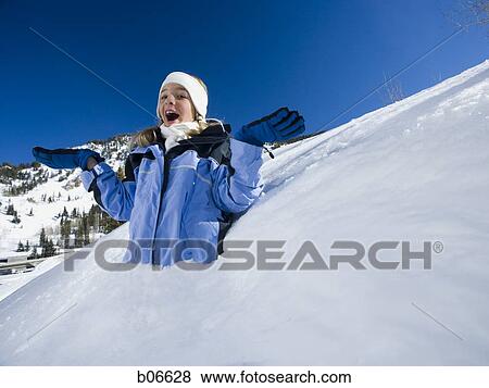 Girl in snowbank View Large Photo Image Stock Photo - Girl in snowbank. Fotosearch