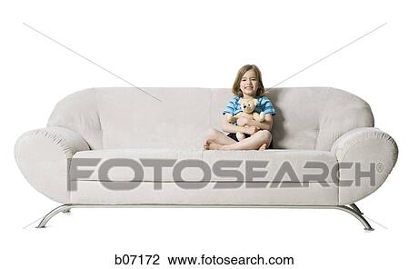 Girl on couch with teddy bear View Large Photo Image Stock Image - Girl on couch with teddy bear. Fotosearch