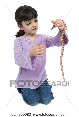 Girl playing with pet snake View Large Photo Image Stock Image - Girl playing with pet snake. Fotosearch