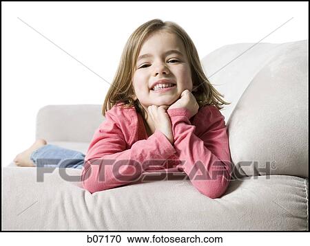 Girl posing on couch View Large Photo Image Stock Image - Girl posing on couch. Fotosearch