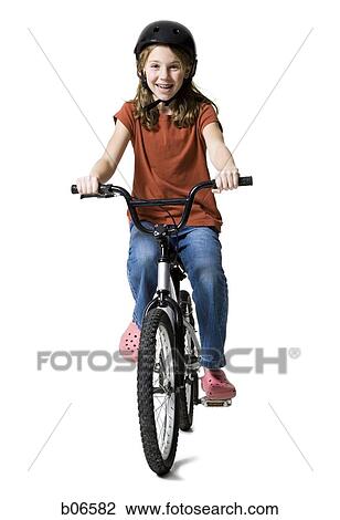 Stock Image - Girl riding bicycle. Fotosearch