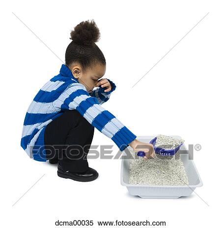 Girl scooping kitty litter and holding nose View Large Photo Image Stock Photography - Girl scooping kitty litter and holding nose. Fotosearch