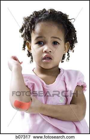 Girl with band-aid on elbow View Large Photo Image Stock Photo - Girl with band-aid on elbow. Fotosearch