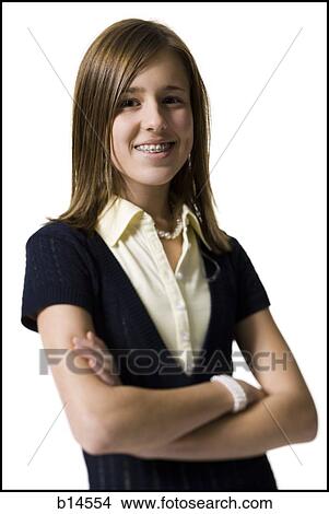Picture - Girl with braces and arms crossed smiling. Fotosearch