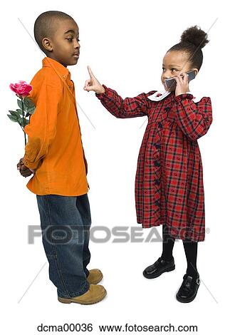 Girl with cellphone and boy with rose View Large Photo Image Stock Photograph - Girl with cellphone and boy with rose. Fotosearch
