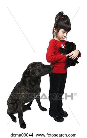 Picture - Girl with dog and stuffed animal. Fotosearch