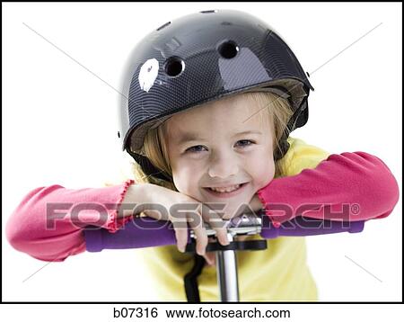 Girl with helmet and scooter View Large Photo Image Stock Photograph - Girl with helmet and scooter. Fotosearch