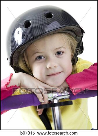 Girl with helmet and scooter View Large Photo Image Stock Photography - Girl with helmet and scooter. Fotosearch
