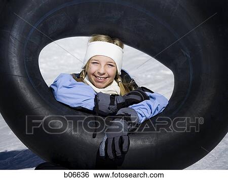 Stock Photograph - Girl with inner tube. Fotosearch