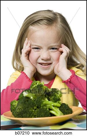 Girl with plate of broccoli View Large Photo Image Stock Image - Girl with plate of broccoli. Fotosearch