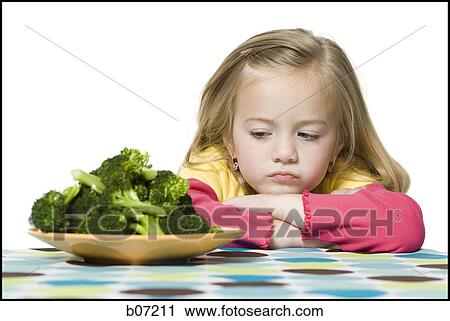 Girl with plate of broccoli View Large Photo Image Stock Image - Girl with plate of broccoli. Fotosearch
