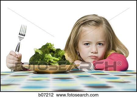 Girl with plate of broccoli View Large Photo Image Stock Image - Girl with plate of broccoli. Fotosearch
