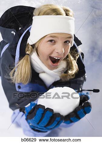 Girl with snowball View Large Photo Image Stock Photo - Girl with snowball. Fotosearch