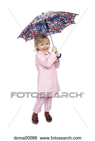 Girl with umbrella and raincoat smiling View Large Photo Image Stock Photograph - Girl with umbrella and raincoat smiling. Fotosearch