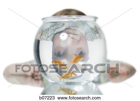 Goldfish and inverted reflection of child in bowl View Large Photo Image Stock Image - Goldfish and inverted reflection of child in bowl. Fotosearch