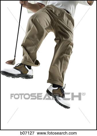 Golfer jumping off the ground View Large Photo Image Stock Photo - Golfer jumping off the ground. Fotosearch