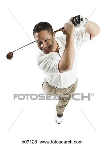 Golfer swinging club View Large Photo Image Stock Photo - Golfer swinging club. Fotosearch
