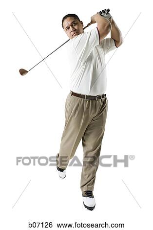 Golfer swinging club View Large Photo Image Stock Photograph - Golfer swinging club. Fotosearch
