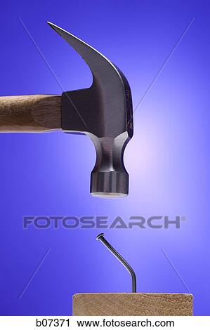 Hammer banging on crooked nail View Large Photo Image Stock Image - Hammer banging on crooked nail. Fotosearch
