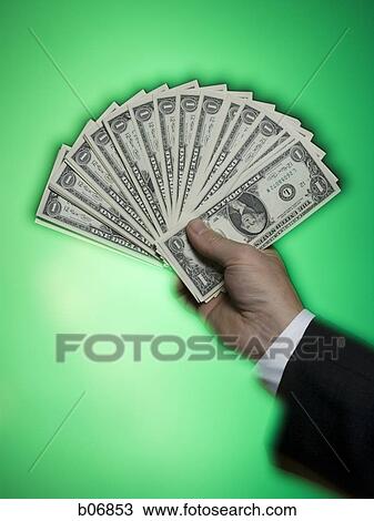 Hand extending fanned out US dollar bills View Large Photo Image Stock Image - Hand extending fanned out US dollar bills. Fotosearch