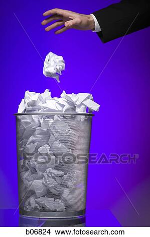 Hand tossing paper into trash can View Large Photo Image Picture - Hand tossing paper into trash can. Fotosearch