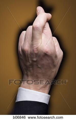 Hand with crossed fingers View Large Photo Image Stock Photograph - Hand with crossed fingers. Fotosearch