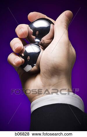 Hand with iron healing balls View Large Photo Image Stock Photo - Hand with iron healing balls. Fotosearch