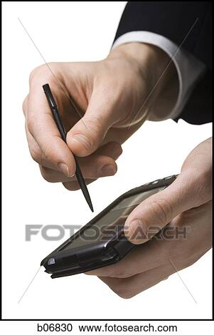 Hands operating palm computer View Large Photo Image Stock Image - Hands operating palm computer. Fotosearch