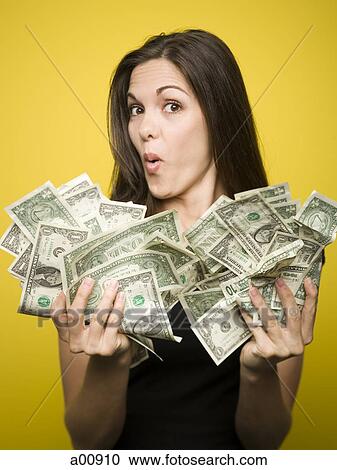 Happy woman holding US dollar bills View Large Photo Image Stock Image - Happy woman holding US dollar bills. Fotosearch