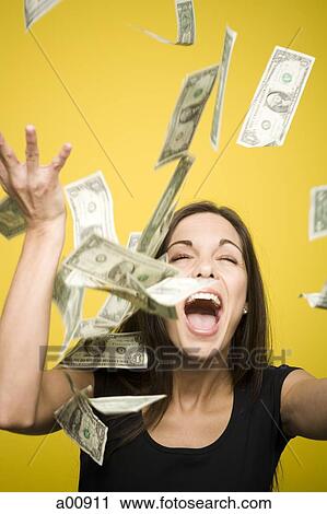 Happy woman tossing US dollar bills into the air View Large Photo Image Stock Image - Happy woman tossing US dollar bills into the air. Fotosearch
