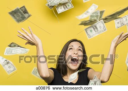 Happy woman tossing US dollar bills into the air View Large Photo Image Stock Photograph - Happy woman tossing US dollar bills into the air. Fotosearch