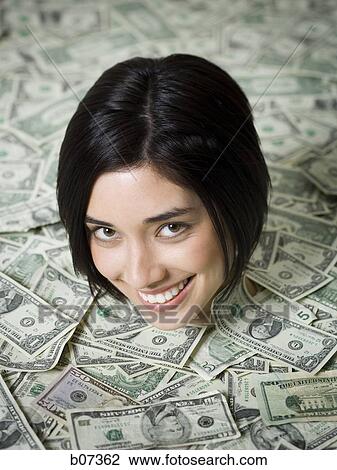 Head of woman emerging from dollar bills View Large Photo Image Stock Image - Head of woman emerging from dollar bills. Fotosearch