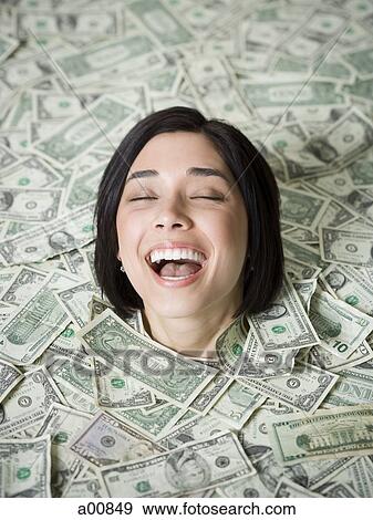 Head of woman emerging from dollar bills View Large Photo Image Stock Photo - Head of woman emerging from dollar bills. Fotosearch