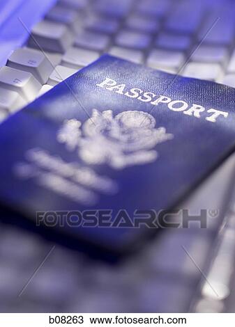 High angle view of an American passport on a computer keyboard View Large Photo Image Stock Image - High angle view of an American passport on a computer keyboard. Fotosearch