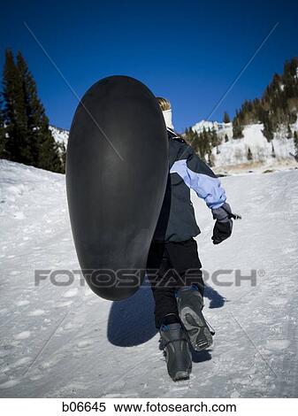 Kid walking with inner tube View Large Photo Image Stock Photography - Kid walking with inner tube. Fotosearch