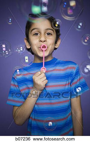 Little boy blowing bubbles View Large Photo Image Stock Photograph - Little boy blowing bubbles. Fotosearch