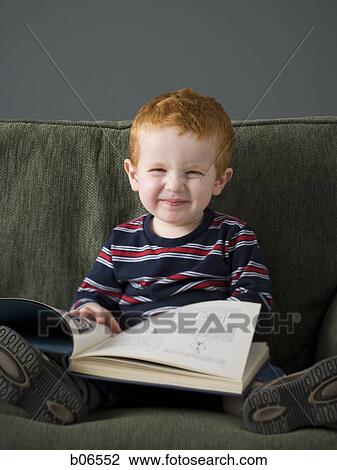 Stock Image - Little boy with book. Fotosearch