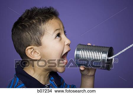 Little boy yelling into tin can with string View Large Photo Image Picture - Little boy yelling into tin can with string. Fotosearch