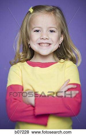 Little girl smiling with arms crossed View Large Photo Image Stock Photo - Little girl smiling with arms crossed. Fotosearch