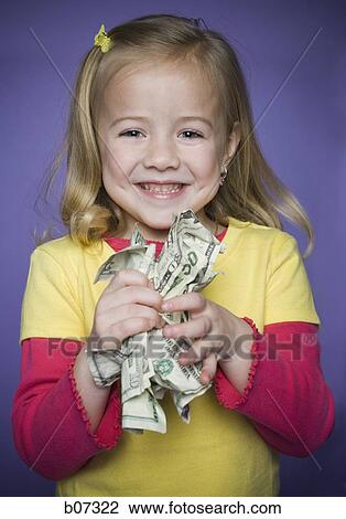 Little girl smiling with bunch of banknotes View Large Photo Image Stock Image - Little girl smiling with bunch of banknotes. Fotosearch