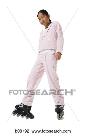 Low angle view of a teenage girl on rollerblades View Large Photo Image Stock Image - Low angle view of a teenage girl on rollerblades. Fotosearch