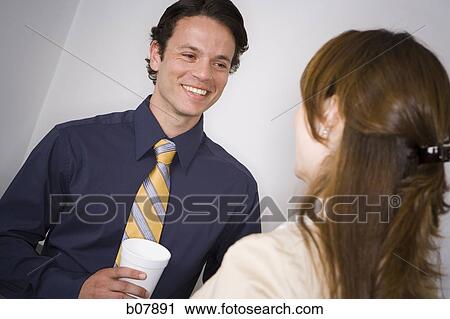 Male and female business colleagues on coffee break View Large Photo Image Stock Image - Male and female business colleagues on coffee break. Fotosearch