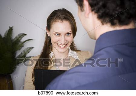 Male and female business colleagues View Large Photo Image Stock Image - Male and female business colleagues. Fotosearch