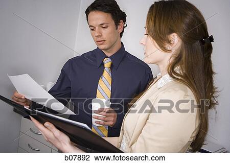 Stock Image - Male and female business colleagues. Fotosearch