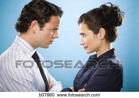 Male and female couple looking at each other View Large Photo Image Stock Image - Male and female couple looking at each other. Fotosearch